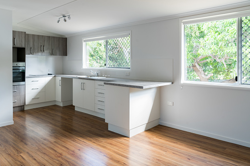 New kitchen in renovated house with timber floating floor